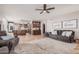 Beautiful living room with tile floors, seamlessly connecting to the adjacent kitchen, ideal for entertaining and Gathering living at 2108 E Tecoma Rd, Phoenix, AZ 85048