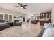 Inviting living room with tile floors seamlessly connecting to the open floor plan, creating a spacious and airy feel at 2108 E Tecoma Rd, Phoenix, AZ 85048