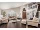 Spacious living room features wood floors, plantation shutters, and a soaring ceiling at 2108 E Tecoma Rd, Phoenix, AZ 85048