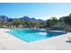 Refreshing community pool with comfortable lounge chairs and scenic mountain views at 2108 E Tecoma Rd, Phoenix, AZ 85048
