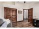 Inviting room featuring a comfortable sofa, closet and wood floor at 2108 E Tecoma Rd, Phoenix, AZ 85048