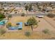 Horse property with paddocks, shelters, and horses, featuring a pool and nearby residential homes at 2151 S Calle Del Marcos --, Casa Grande, AZ 85194