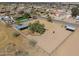 Large horse property with paddocks, shelters, and a refreshing pool, with neighborhood in the background at 2151 S Calle Del Marcos --, Casa Grande, AZ 85194