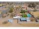 Aerial view of charming home with a refreshing pool and covered parking in a desert landscape at 2151 S Calle Del Marcos --, Casa Grande, AZ 85194