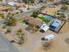 Aerial view showcasing this charming home with a refreshing pool and covered parking, nestled in a desert landscape at 2151 S Calle Del Marcos --, Casa Grande, AZ 85194