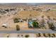 Wide aerial view featuring home, horse property, shelters, and a desert landscape at 2151 S Calle Del Marcos --, Casa Grande, AZ 85194
