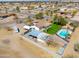 Aerial view displaying this charming home with a refreshing pool and covered parking in a desert landscape at 2151 S Calle Del Marcos --, Casa Grande, AZ 85194