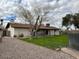 Large backyard showcasing the spacious lawn and a fenced-in pool area in the distance at 2151 S Calle Del Marcos --, Casa Grande, AZ 85194