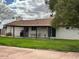 Spacious backyard with a well-maintained lawn, covered patio and exterior view at 2151 S Calle Del Marcos --, Casa Grande, AZ 85194