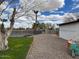 Expansive backyard with mature tree, fenced pool and a gravel path leading to the property at 2151 S Calle Del Marcos --, Casa Grande, AZ 85194
