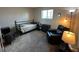 Cozy bedroom with comfy chair, natural light, and neutral carpet at 2151 S Calle Del Marcos --, Casa Grande, AZ 85194