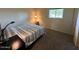 Cozy bedroom with a comfortable bed, carpet, and a window providing natural light at 2151 S Calle Del Marcos --, Casa Grande, AZ 85194