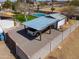 Aerial view of a covered carport with truck and storage area next to privacy wall and home at 2151 S Calle Del Marcos --, Casa Grande, AZ 85194