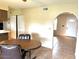 Dining area features tile flooring and neutral walls, with views into the kitchen at 2151 S Calle Del Marcos --, Casa Grande, AZ 85194