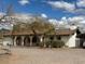 Ranch style house features a private front yard, covered parking and mature trees at 2151 S Calle Del Marcos --, Casa Grande, AZ 85194