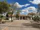 Charming ranch-style home with a gravel front yard, mature trees, and a covered porch in a serene setting at 2151 S Calle Del Marcos --, Casa Grande, AZ 85194