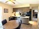 Cozy eat-in kitchen features laminate countertops and views of the adjacent dining space at 2151 S Calle Del Marcos --, Casa Grande, AZ 85194