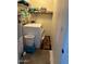 Convenient laundry room equipped with a washer, dryer, shelves and water heater at 2151 S Calle Del Marcos --, Casa Grande, AZ 85194