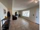Bright living room with neutral tile flooring and arched windows offers an inviting atmosphere at 2151 S Calle Del Marcos --, Casa Grande, AZ 85194