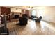 Spacious living room featuring a fireplace, tile floors, and comfortable seating arrangements, creating a welcoming space at 2151 S Calle Del Marcos --, Casa Grande, AZ 85194