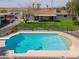 Backyard with a refreshing pool, enclosed by a fence, and surrounded by green grass, perfect for outdoor fun at 2151 S Calle Del Marcos --, Casa Grande, AZ 85194