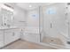 Elegant bathroom with a soaking tub, glass-enclosed shower, and a modern vanity at 21539 S 191St Pl, Queen Creek, AZ 85140