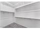 Spacious walk-in closet with ample shelving and rod space for organized storage at 21539 S 191St Pl, Queen Creek, AZ 85140