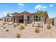 Well-maintained front yard with desert landscaping, accentuating the home's curb appeal at 21539 S 191St Pl, Queen Creek, AZ 85140