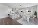 Open concept kitchen with island seating, stainless steel appliances, and adjacent dining area at 21539 S 191St Pl, Queen Creek, AZ 85140