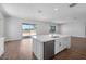 Kitchen island featuring a sink, dishwasher, and barstool seating at 21539 S 191St Pl, Queen Creek, AZ 85140