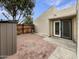 Private back yard with brick patio, wooden fence, and sliding glass door at 2155 W Farmdale Ave # 24, Mesa, AZ 85202