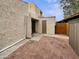 Cozy backyard featuring a brick patio and direct access through the sliding back door at 2155 W Farmdale Ave # 24, Mesa, AZ 85202
