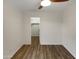 Bright bedroom featuring wood floors with a closet for easy storage solutions at 2155 W Farmdale Ave # 24, Mesa, AZ 85202