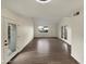 Spacious living room featuring wood flooring and glass doors leading to the outdoors at 2155 W Farmdale Ave # 24, Mesa, AZ 85202