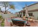 Serene backyard featuring comfortable lounge chair, rocking chairs and outdoor dining set at 21860 N 41St St, Phoenix, AZ 85050