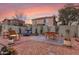 Spacious backyard with seating area, lounge chair and colorful outdoor rug at 21860 N 41St St, Phoenix, AZ 85050