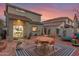 Cozy backyard space with a brick patio, outdoor seating, a grill, and desert landscaping at 21860 N 41St St, Phoenix, AZ 85050