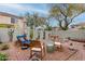 Inviting backyard featuring a lounge chair, rocking chairs, patio and low-maintenance landscaping at 21860 N 41St St, Phoenix, AZ 85050