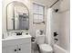 Bathroom with a vanity, round mirror, window and combined shower and tub with white shower curtain at 21860 N 41St St, Phoenix, AZ 85050