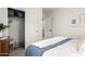 Bedroom featuring ample closet space, neutral decor, a queen bed with patterned bedding, and natural light at 21860 N 41St St, Phoenix, AZ 85050