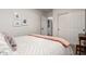 Bright bedroom featuring closet and washer/dryer access and neutral decor with natural light at 21860 N 41St St, Phoenix, AZ 85050