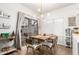 Bright dining area with modern table, chairs, and stylish bar cart near a sliding glass door at 21860 N 41St St, Phoenix, AZ 85050