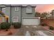 Charming two-story home with a two-car garage, desert landscaping, and a beautiful sunrise at 21860 N 41St St, Phoenix, AZ 85050
