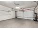 Spacious three car garage featuring epoxy flooring at 21860 N 41St St, Phoenix, AZ 85050