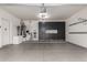 Well-lit garage with epoxy floors and custom cabinetry at 21860 N 41St St, Phoenix, AZ 85050