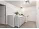 Hallway featuring a decorative cabinet and neutral carpet flooring at 21860 N 41St St, Phoenix, AZ 85050