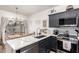 Contemporary kitchen with a breakfast bar and stainless steel dishwasher overlooking the backyard at 21860 N 41St St, Phoenix, AZ 85050