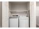 Laundry room featuring a full size washer and dryer, a shelf and a vent at 21860 N 41St St, Phoenix, AZ 85050