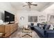 Cozy living room with large TV, comfortable sectional sofa, and modern decor at 21860 N 41St St, Phoenix, AZ 85050