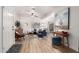 Bright living room featuring a modern ceiling fan, wood floors, and large painting at 21860 N 41St St, Phoenix, AZ 85050